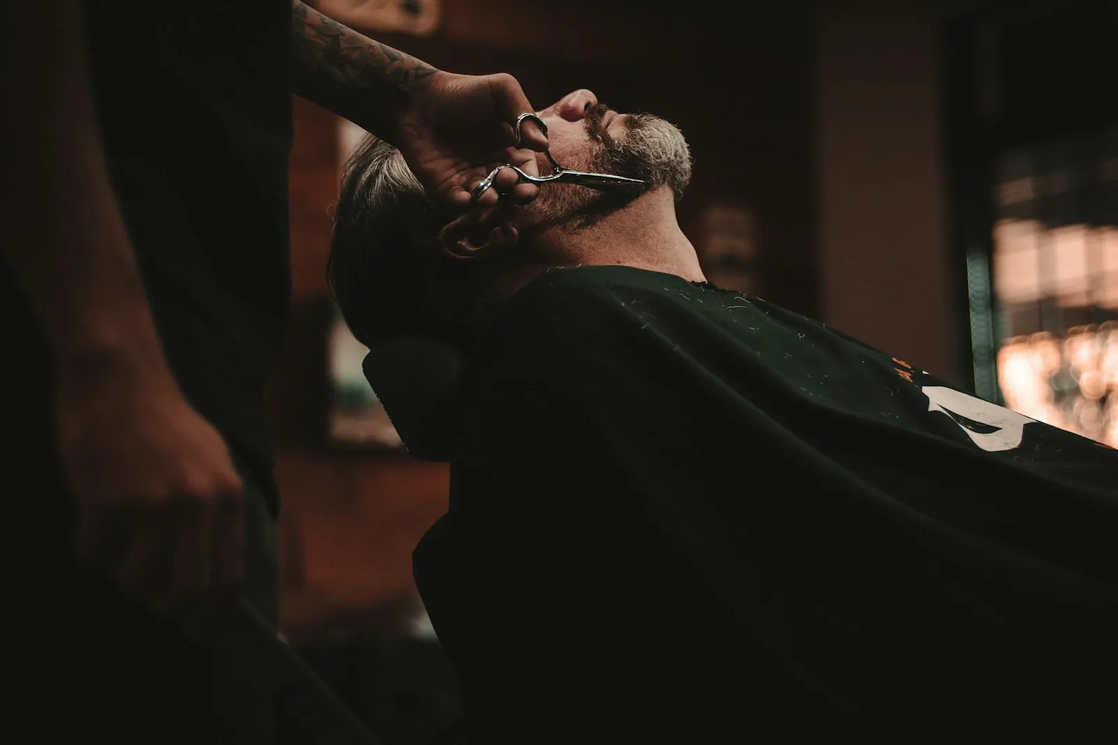 A barber fading a client's hair at Fade Culture, Bristol